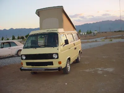 Beige VW Vanagon Westfalia with pop-top raised
