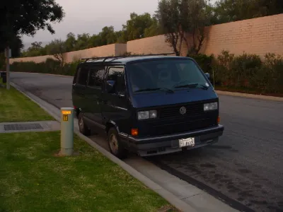 Dark VW Vanagon parked on a street