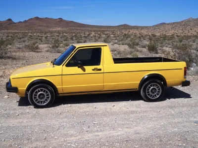 Yellow VW Rabbit Pickup in the desert